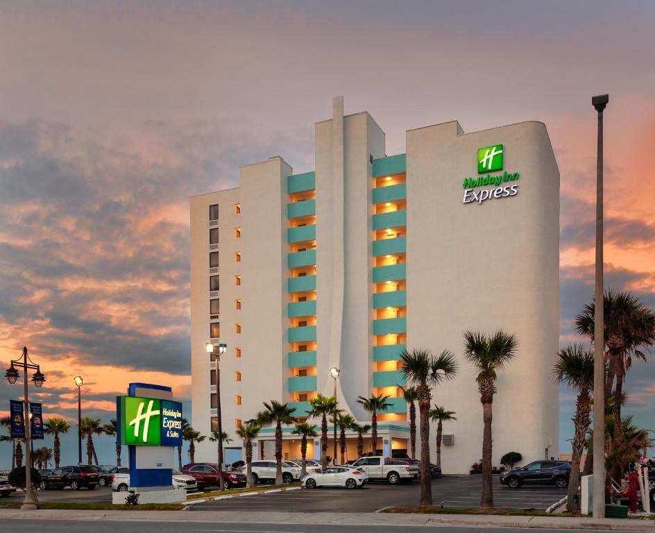 a large building with a mriott express sign on it at Holiday Inn Express & Suites Oceanfront Daytona Beach Shores by IHG in Daytona Beach