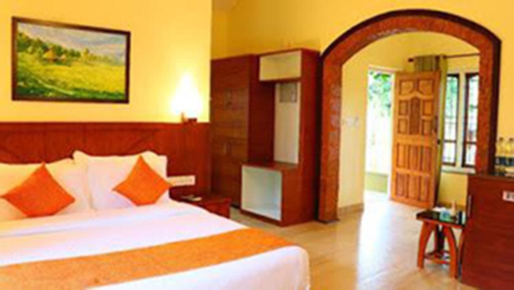 Postel nebo postele na pokoji v ubytování Indeevara Luxury Resort and Spa, Wayanad