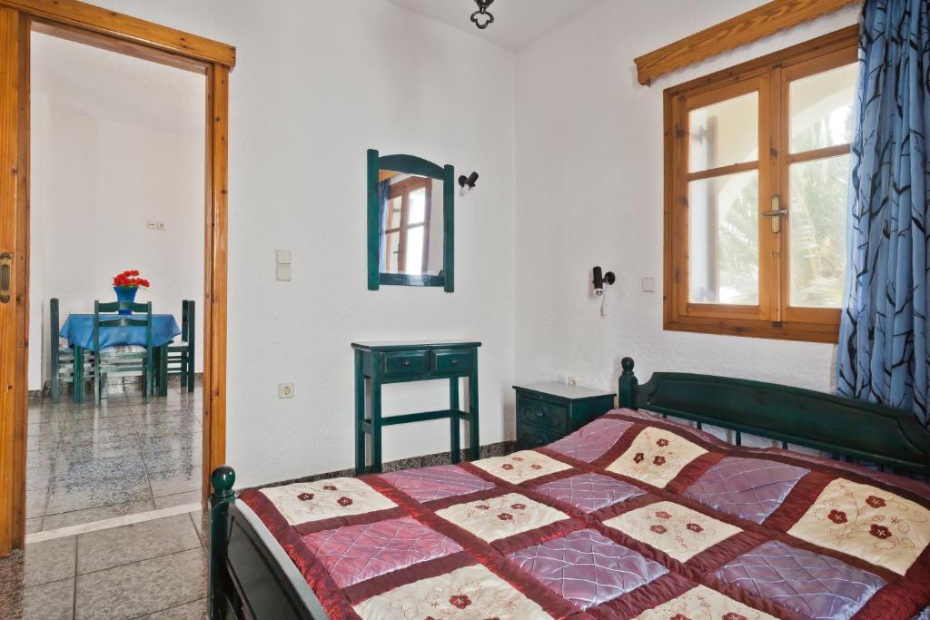 Postel nebo postele na pokoji v ubytování Montemar Studios & Apartments