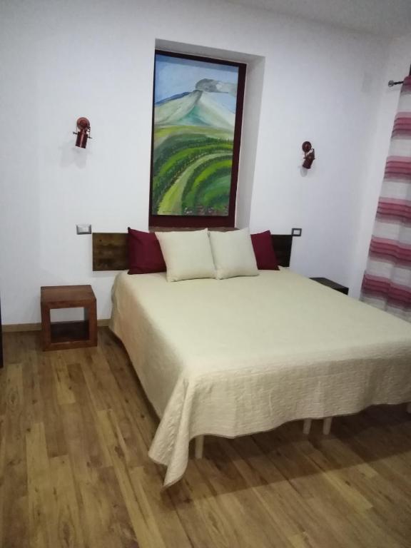 Posteľ alebo postele v izbe v ubytovaní B&B Le Vie del Borgo