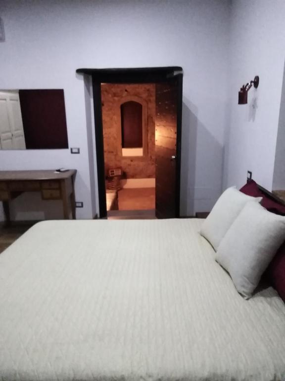 Posteľ alebo postele v izbe v ubytovaní B&B Le Vie del Borgo