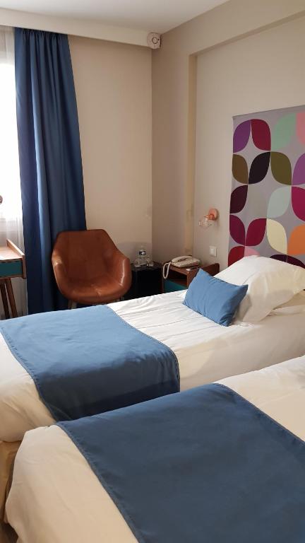 Postel nebo postele na pokoji v ubytování Hotel de Champagne