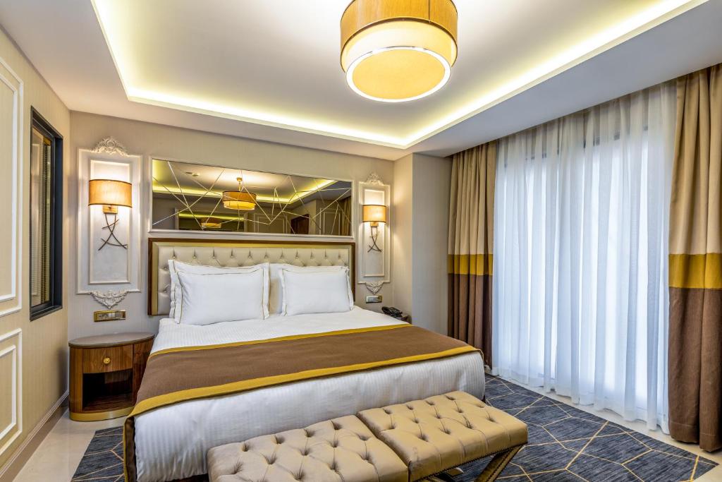 Postel nebo postele na pokoji v ubytování Beethoven Senfoni Hotel
