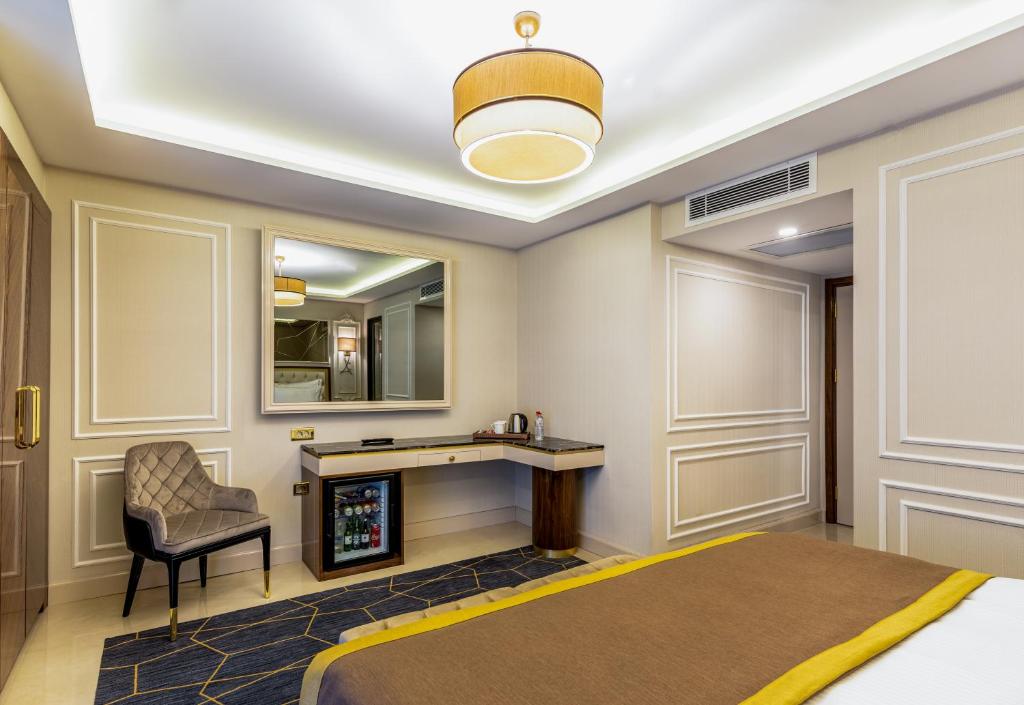 Postel nebo postele na pokoji v ubytování Beethoven Senfoni Hotel