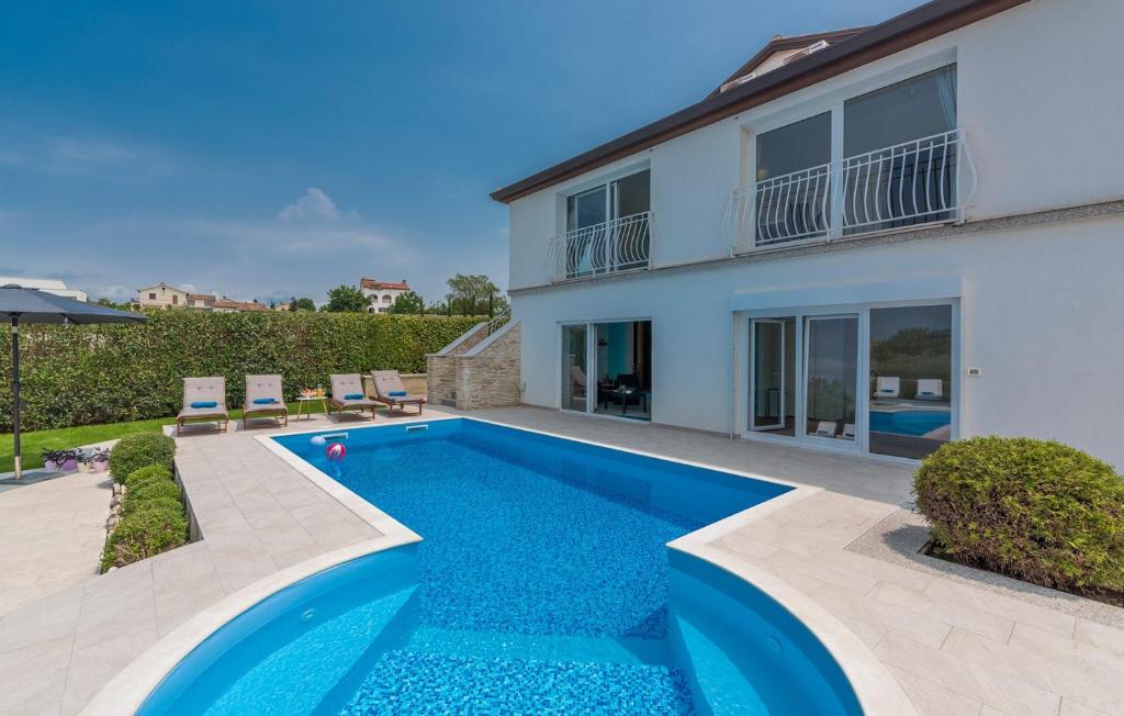 a swimming pool in the backyard of a house at Luxury Villa Lavanda with Pool and Sauna in Kanfanar