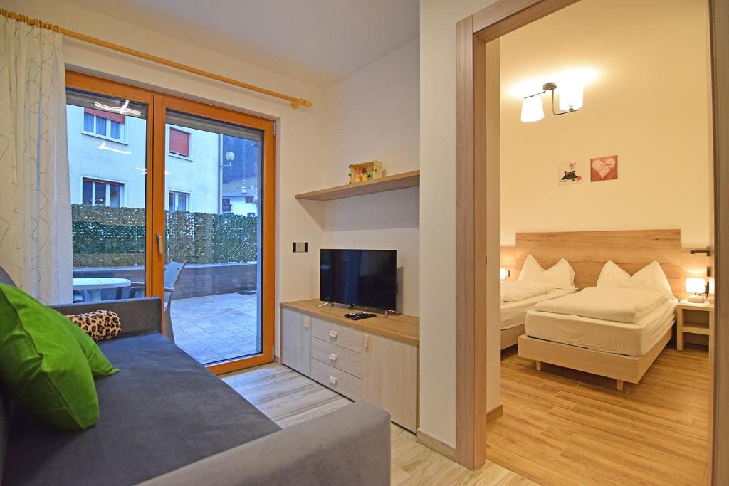 Postel nebo postele na pokoji v ubytování casa vacanze arcobaleno
