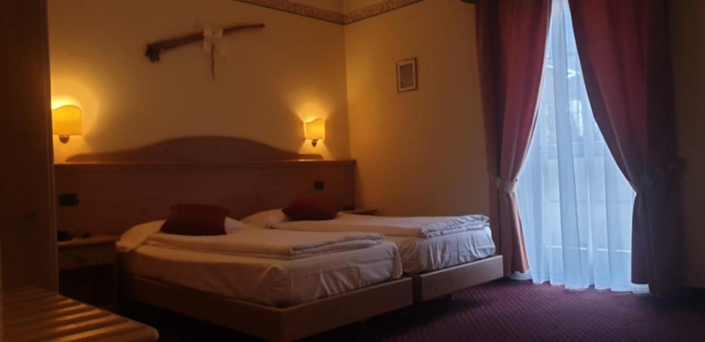 Llit o llits en una habitació de Albergo Bernard