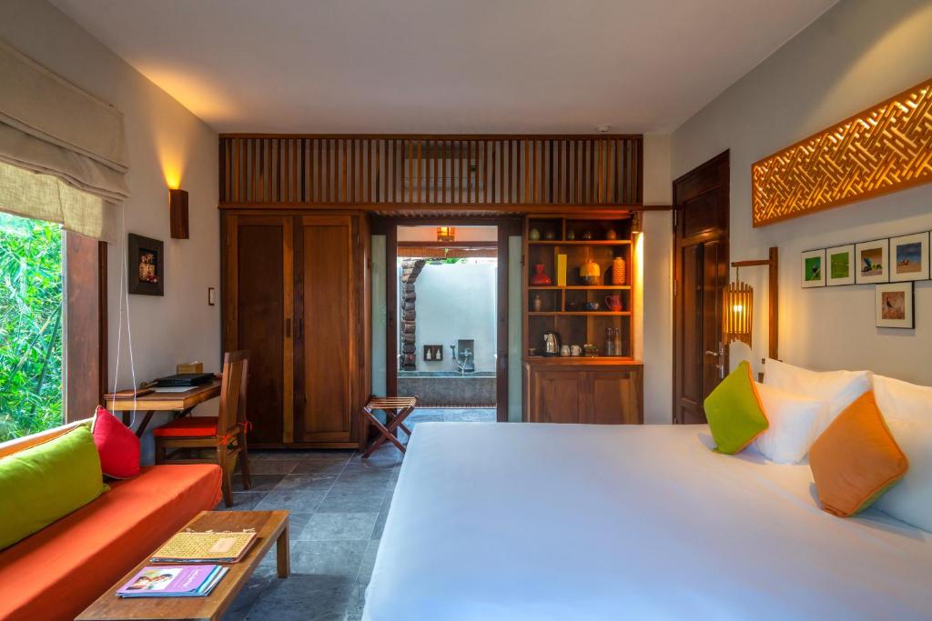 Postel nebo postele na pokoji v ubytování Hoi An Chic - Green Retreat