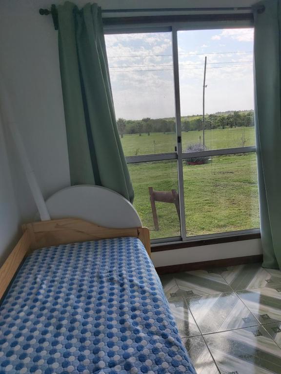 Postel nebo postele na pokoji v ubytování Cabañas San Jorge