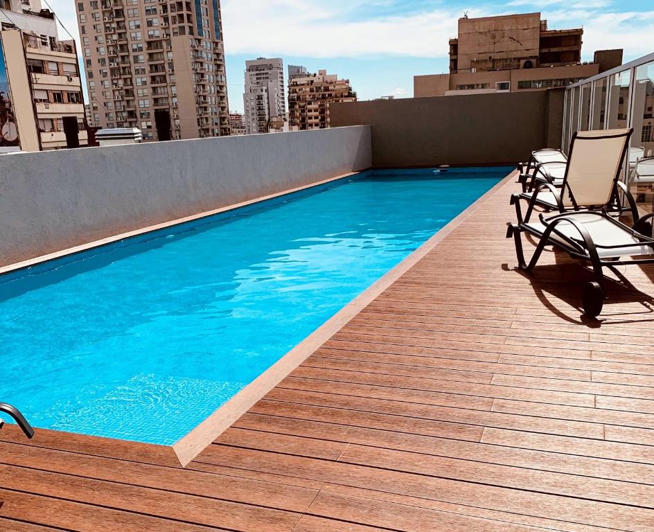 a swimming pool on the roof of a building at PALERMO Twin in Buenos Aires