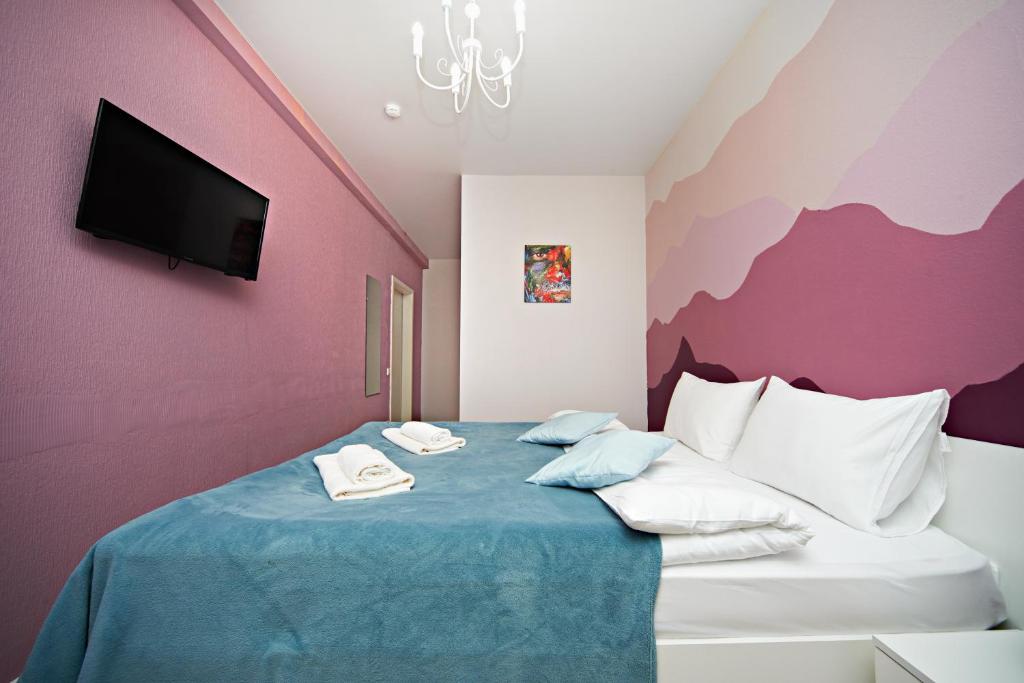 
Кровать или кровати в номере Отель Апельсин на Шаболовской
