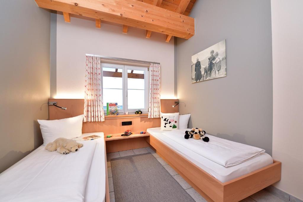 Postel nebo postele na pokoji v ubytování Haus im Wäldle