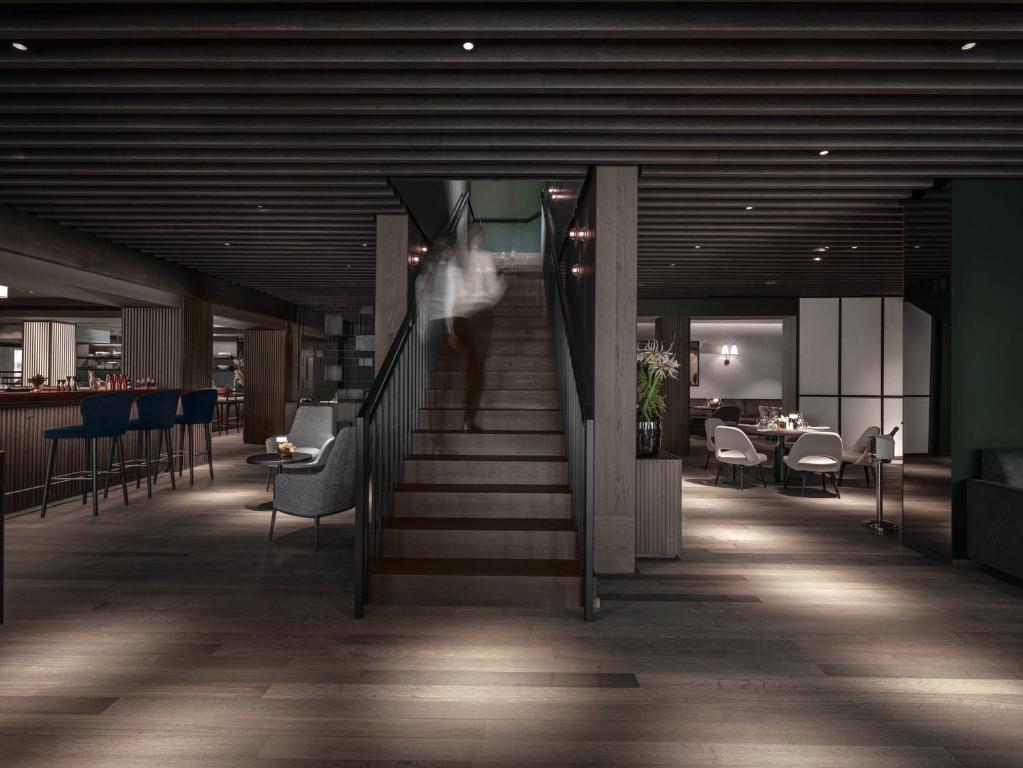 Postel nebo postele na pokoji v ubytování Hotel Weisses Roessl