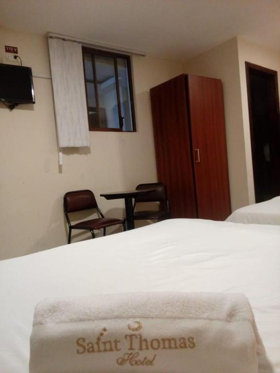 Postel nebo postele na pokoji v ubytování Hotel Saint Thomas