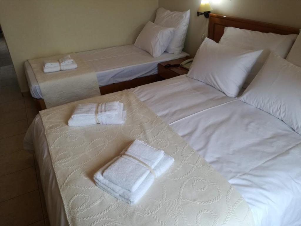 Postel nebo postele na pokoji v ubytování PARNON HOTEL