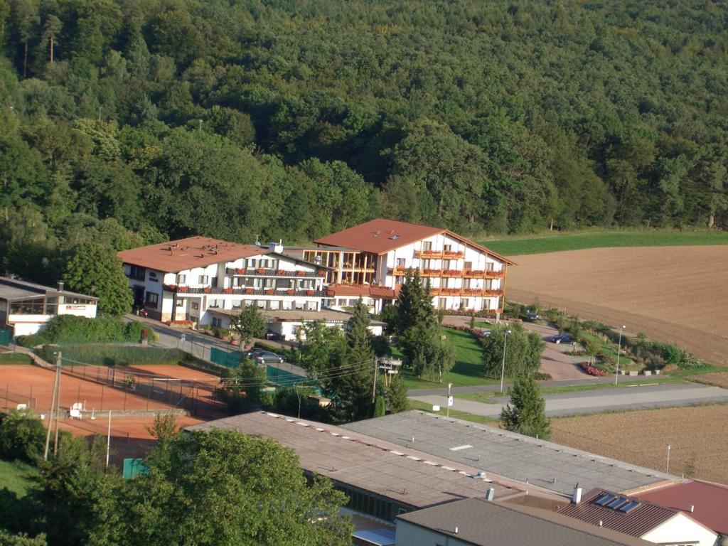 an aerial view of a building with a field and trees at Villa Waldeck in Eppingen