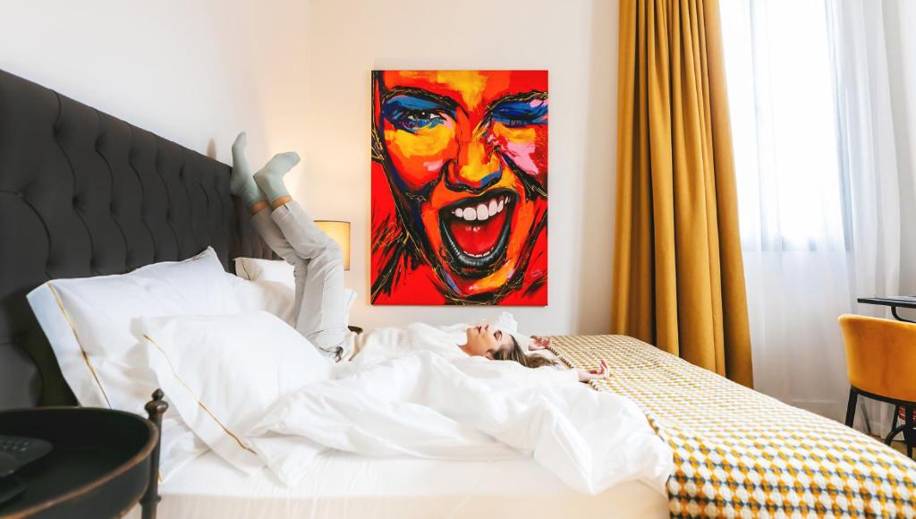 A bed or beds in a room at Joya del Casco Boutique Hotel by Shiadu