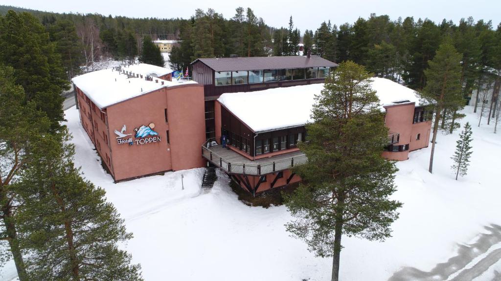 an aerial view of a building in the snow at Hotell Toppen in Storuman