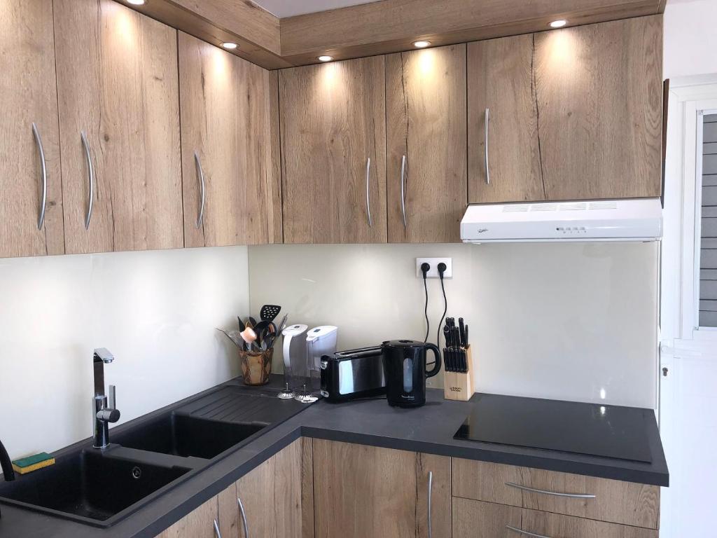 Kuchyň nebo kuchyňský kout v ubytování Duplex luxe au NBBC , les pieds dans le sable