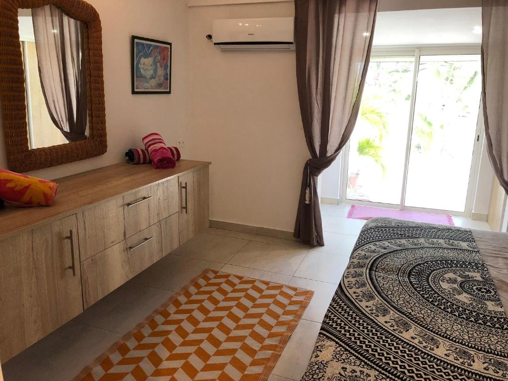Postel nebo postele na pokoji v ubytování Duplex luxe au NBBC , les pieds dans le sable