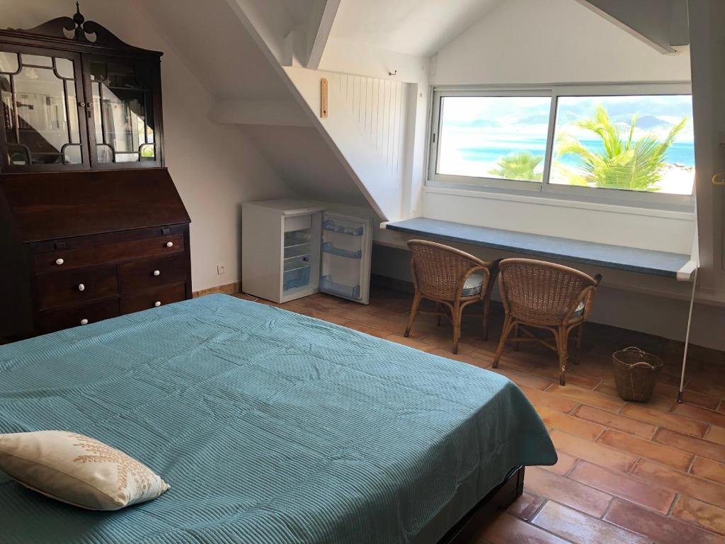 Postel nebo postele na pokoji v ubytování Duplex luxe au NBBC , les pieds dans le sable