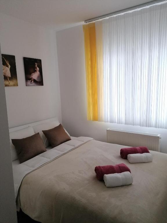 מיטה או מיטות בחדר ב-Apartman Tamara