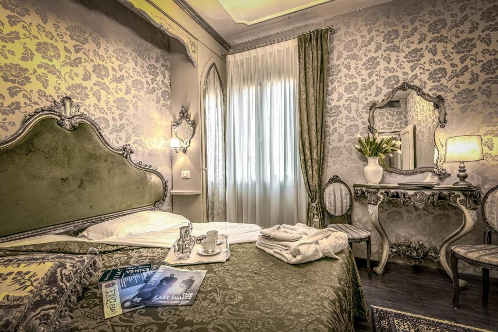 Hotel Bel Sito e Berlinoにあるベッド