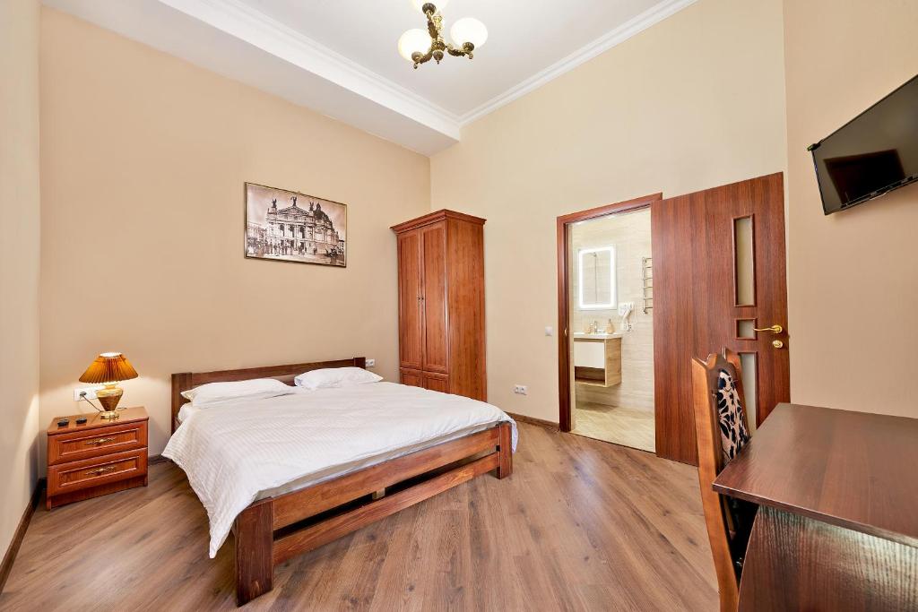 Postel nebo postele na pokoji v ubytování Cossacks Hostel