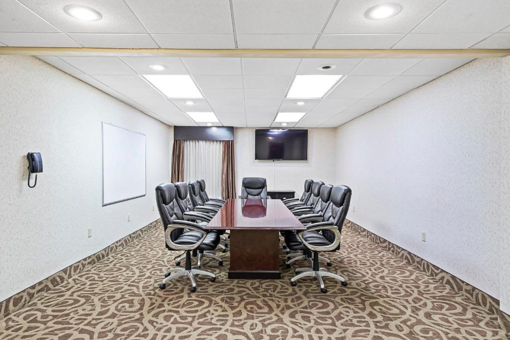a conference room with a table and chairs at Holiday Inn - St. Petersburg West by IHG in St Petersburg
