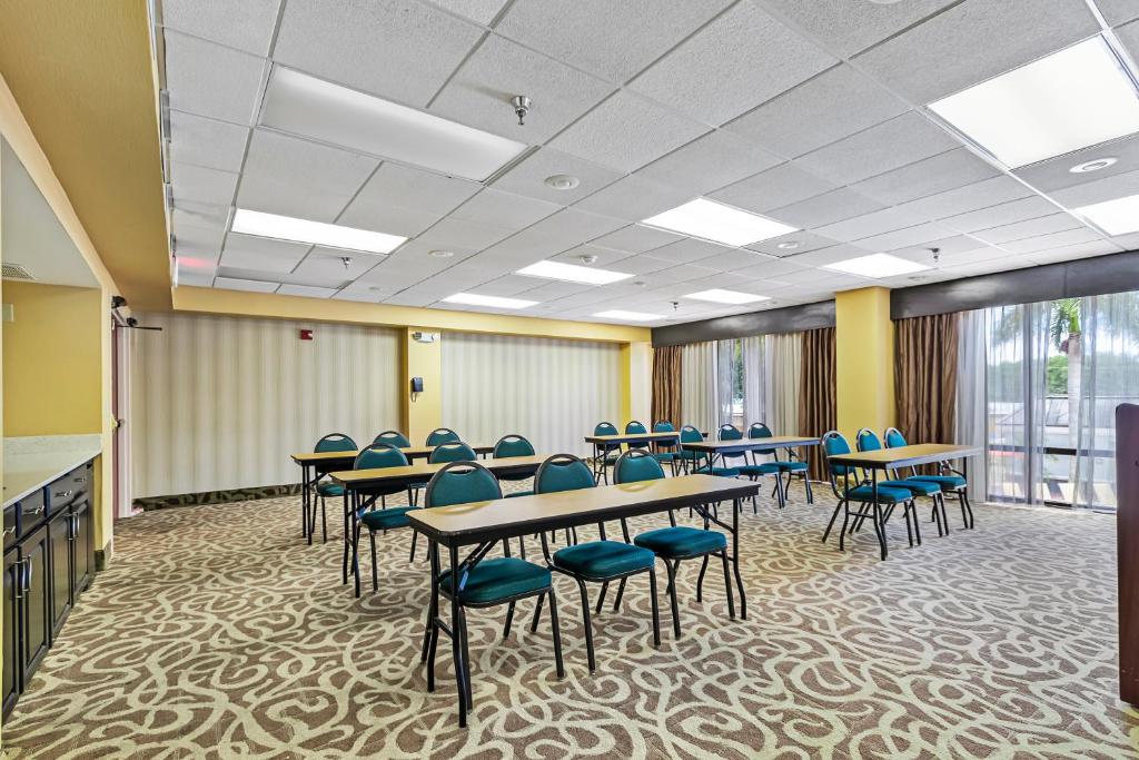 a classroom with tables and chairs in a room at Holiday Inn - St. Petersburg West by IHG in St Petersburg