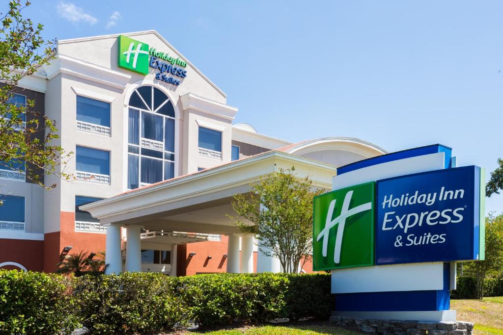 a sign in front of a holiday inn express and suites at Holiday Inn Express Hotel & Suites Tampa-Fairgrounds-Casino, an IHG Hotel in Tampa