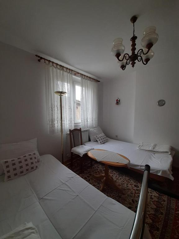Postel nebo postele na pokoji v ubytování Mimy Rooms
