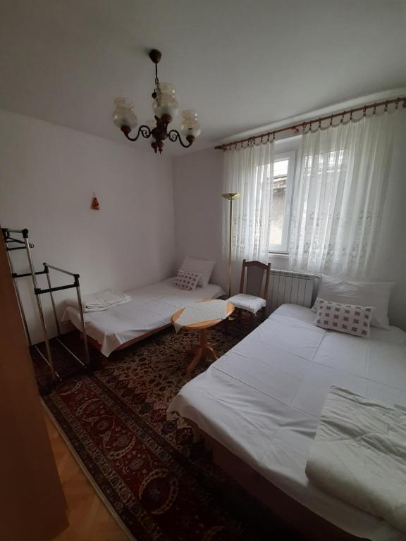 Postel nebo postele na pokoji v ubytování Mimy Rooms