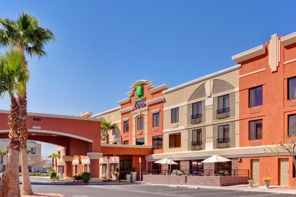 a hotel with a palm tree in front of it at Holiday Inn Express Hotel and Suites - Henderson, an IHG Hotel in Las Vegas