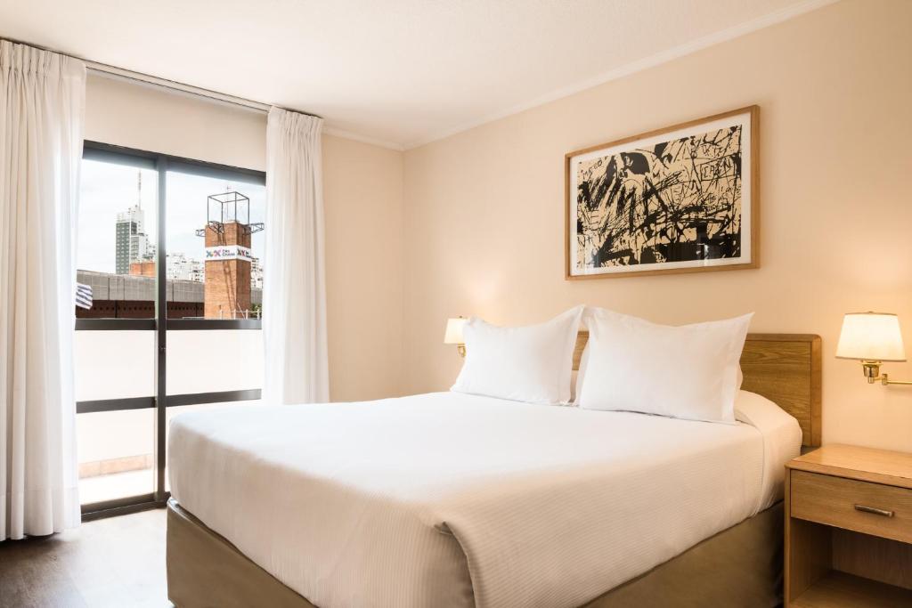Postel nebo postele na pokoji v ubytování Alfa Suites - Montevideo