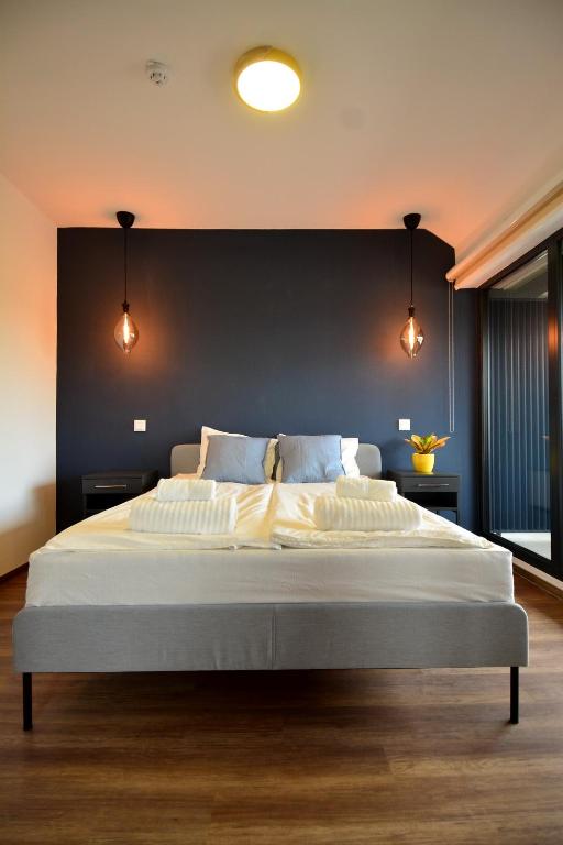 Ένα ή περισσότερα κρεβάτια σε δωμάτιο στο Ludwig Hotel