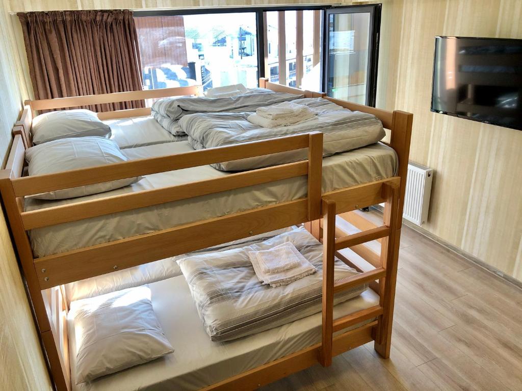 Postel nebo postele na pokoji v ubytování GVC 315 Atrium New Gudauri