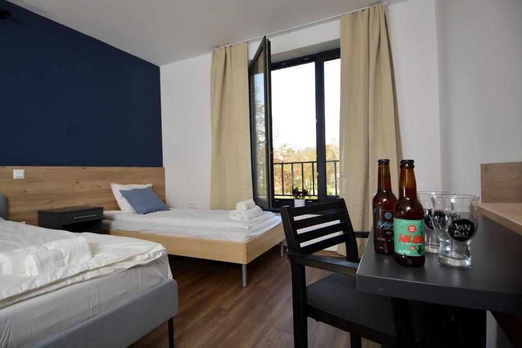 Ένα ή περισσότερα κρεβάτια σε δωμάτιο στο Ludwig Hotel