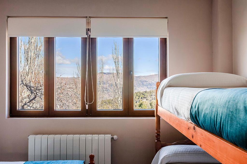 Ένα ή περισσότερα κρεβάτια σε δωμάτιο στο Hotel Sulayr