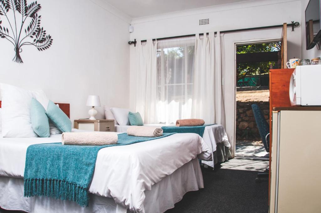 Ένα ή περισσότερα κρεβάτια σε δωμάτιο στο Ferndale Lodge
