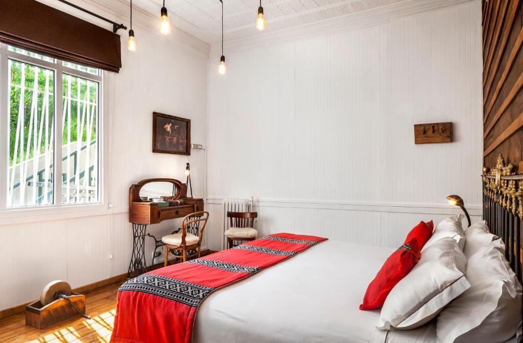 Postel nebo postele na pokoji v ubytování Hotel Boutique La Yegua Loca