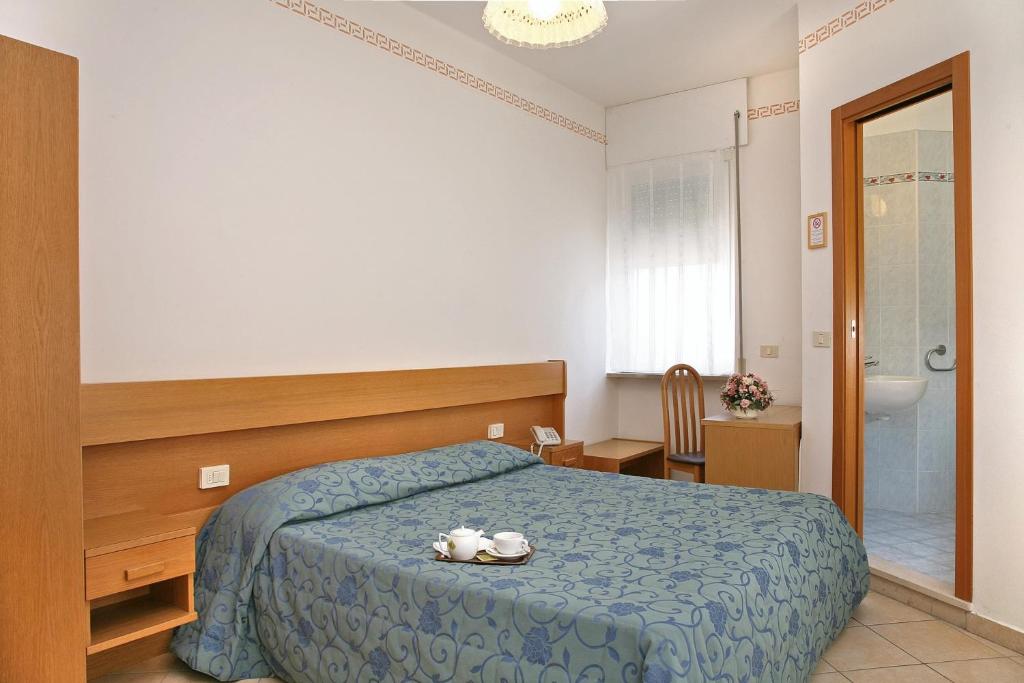 Postel nebo postele na pokoji v ubytování Hotel Marina