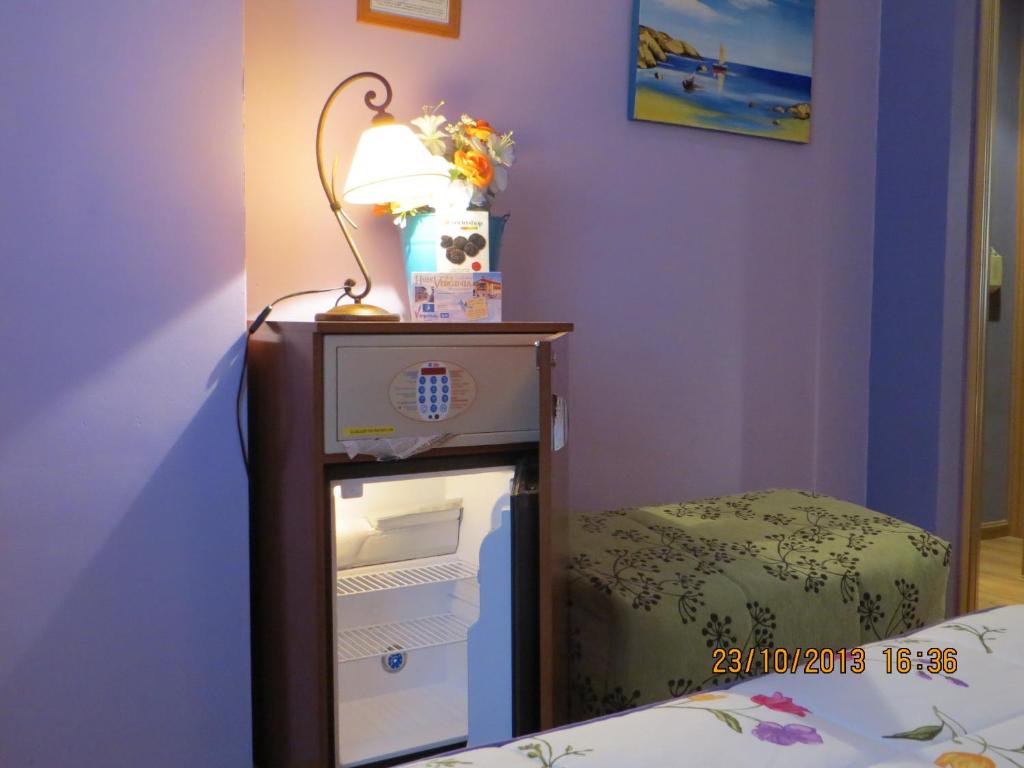 Postel nebo postele na pokoji v ubytování Hotel Virginia R.H.