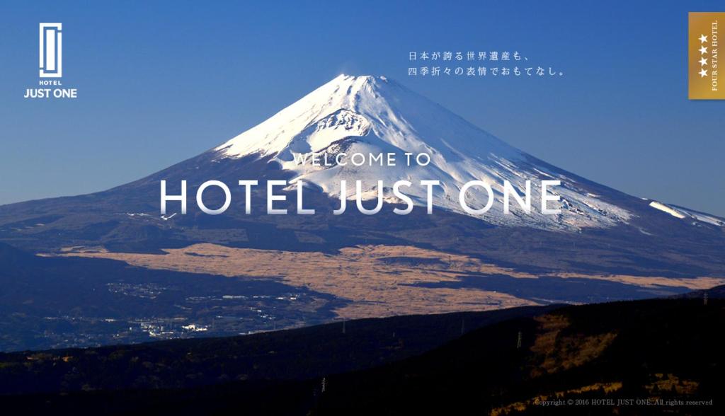a mountain with the words welcome to hotel just one at Hotel Just One Susono in Susono
