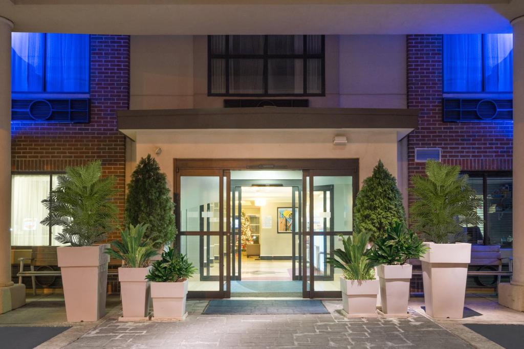 an entrance to a building with potted plants at Holiday Inn Express Hotel & Suites Easton by IHG in Easton