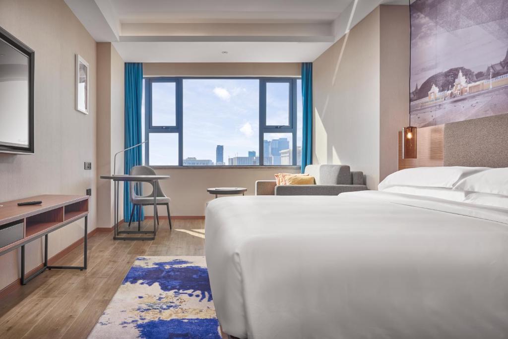 Postel nebo postele na pokoji v ubytování Aurea Central Hotel