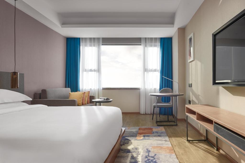 Postel nebo postele na pokoji v ubytování Aurea Central Hotel
