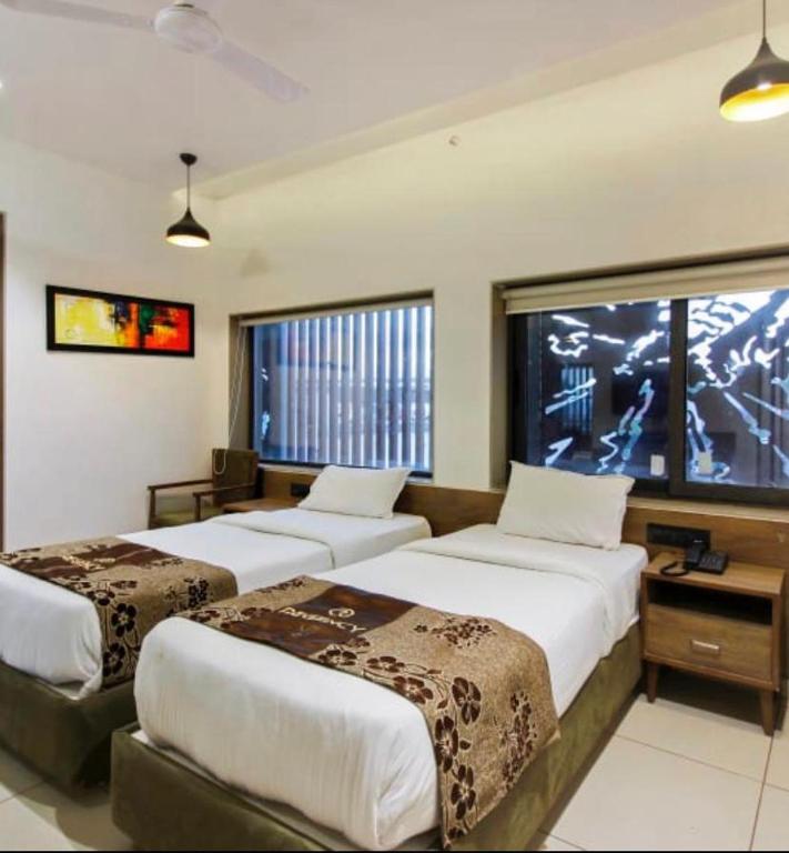 Posteľ alebo postele v izbe v ubytovaní Hotel Regency