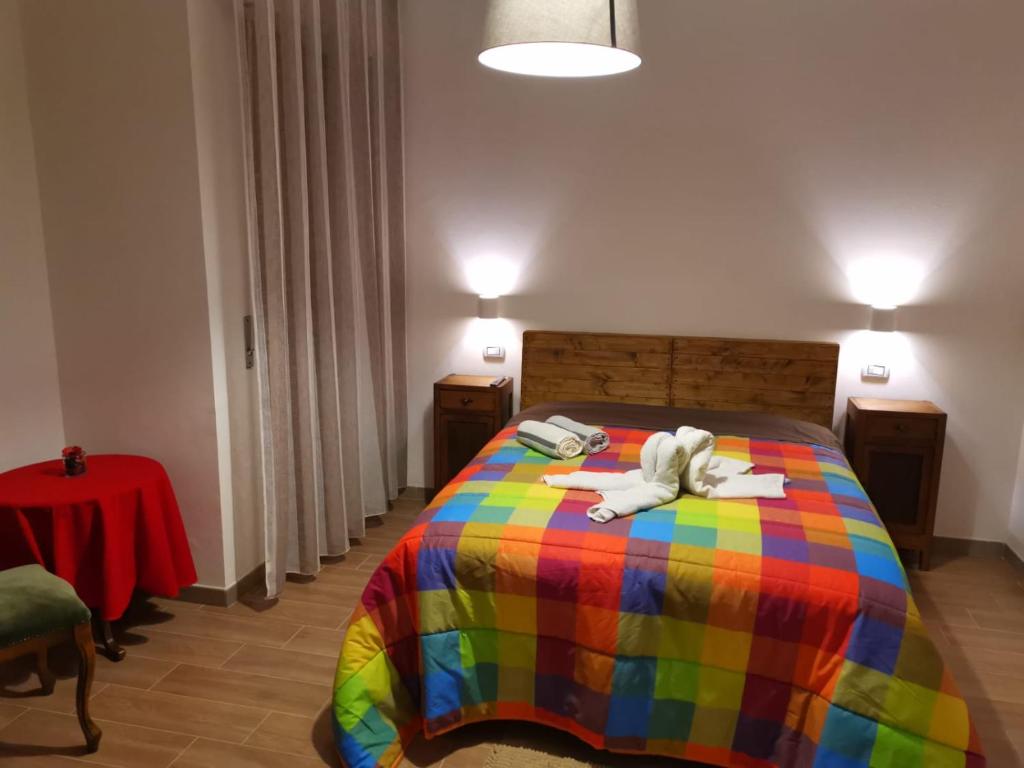 A bed or beds in a room at B&B Belli Dentro
