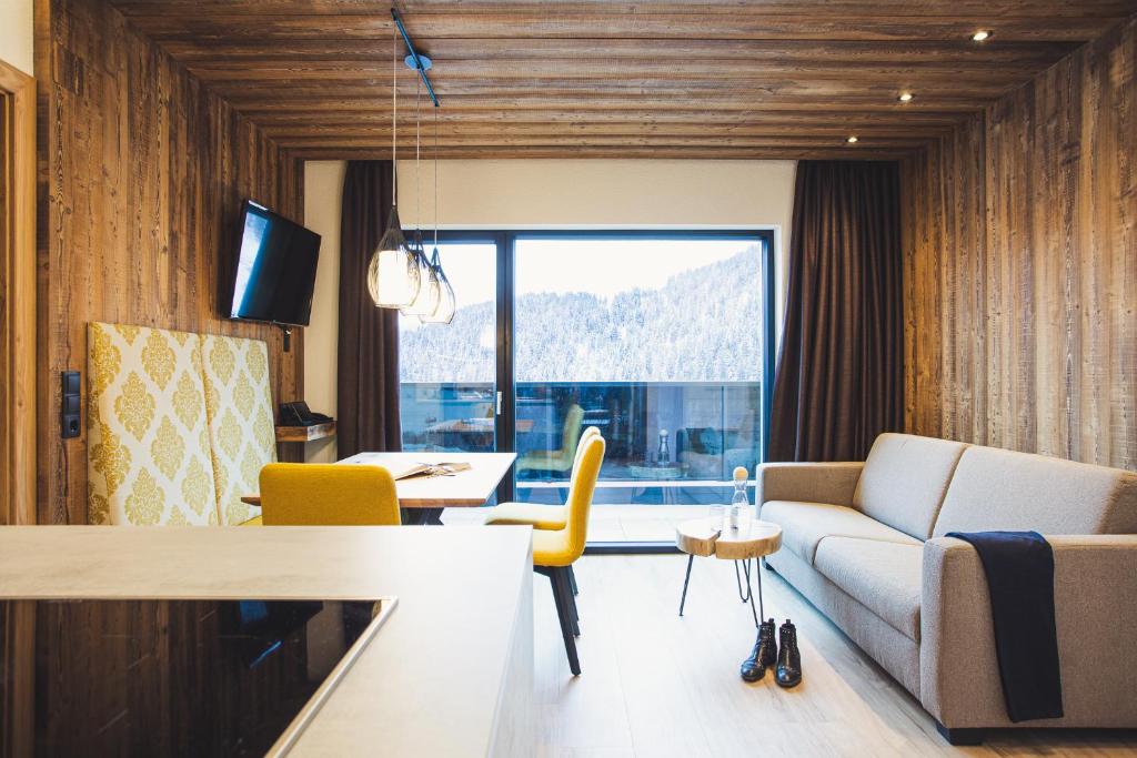 Televízia a/alebo spoločenská miestnosť v ubytovaní Austria Aparthotel